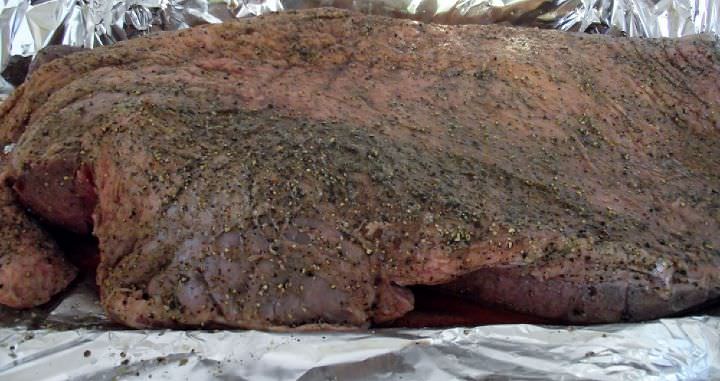 Brisket seasoned with salt and pepper.