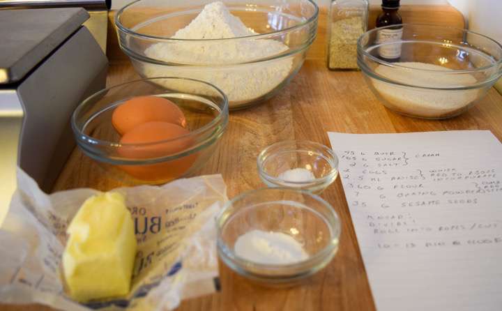 Ingredients for sesame cookies: flour, butter, sugar, salt, baking powder, eggs,sesame seeds, and anise oil.