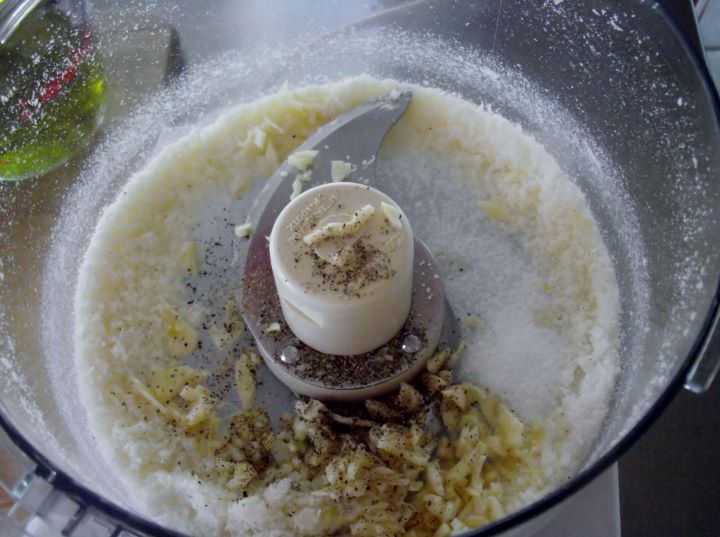 Garlic, pepper, and Parmigiano in the food processor.