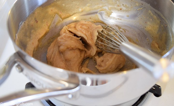 Whisking roux in a saucier.